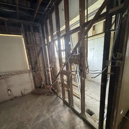 Exposed wall framing during house rewire